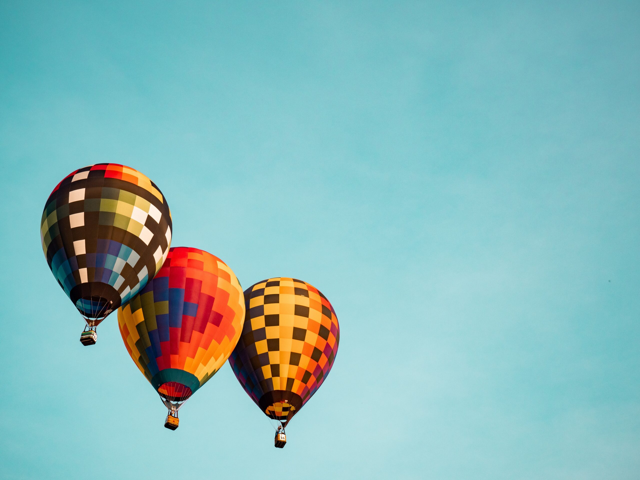 Picture of blue sky with three hot air baloons